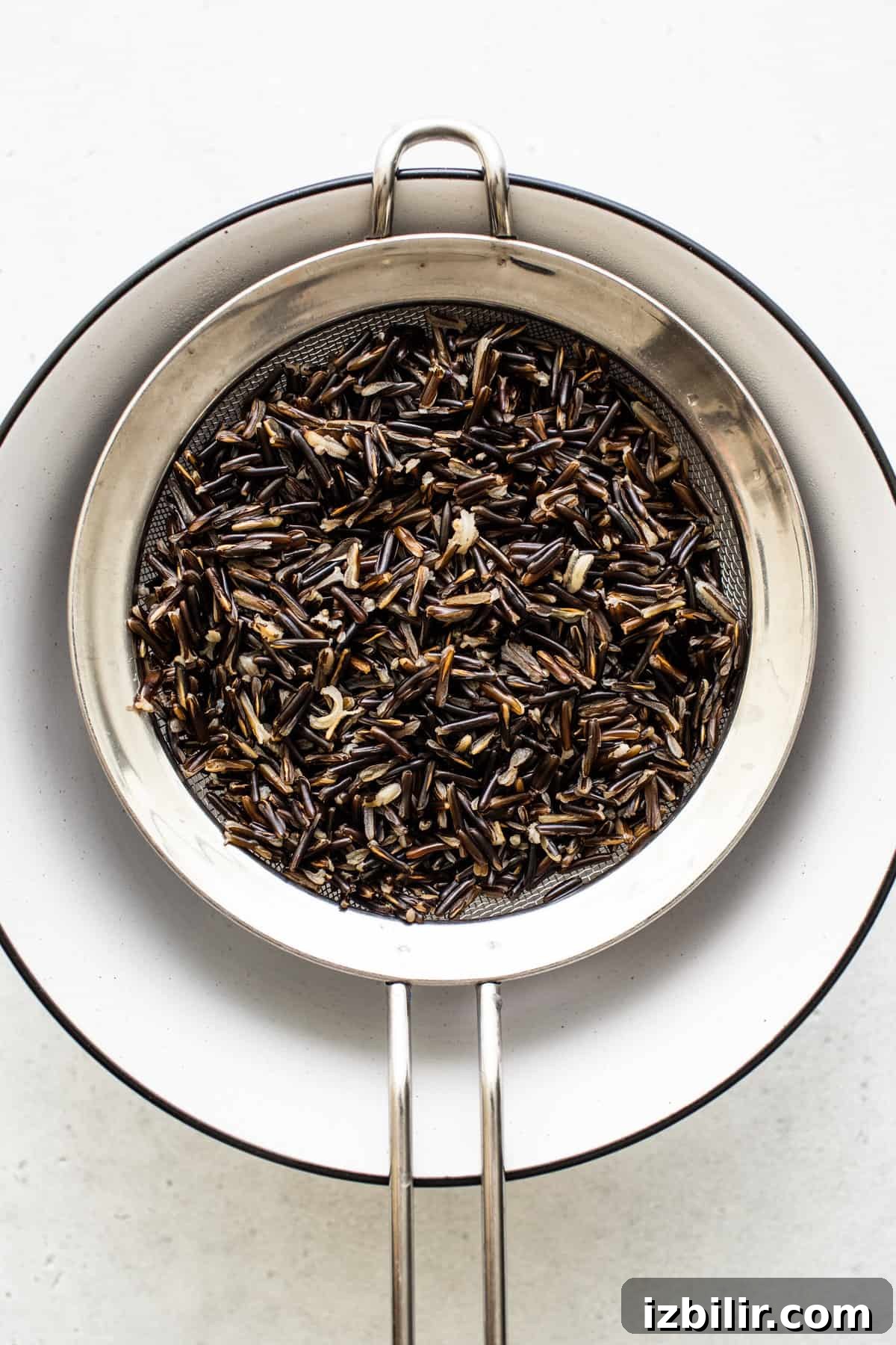 How to Cook Wild Rice: Stovetop, Oven and Rice Cooker Tips 5 Cooked wild rice in a pot