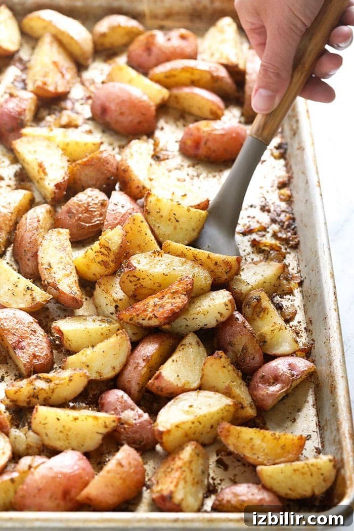 Crispy roasted red potatoes Tossing red potatoes on a pan