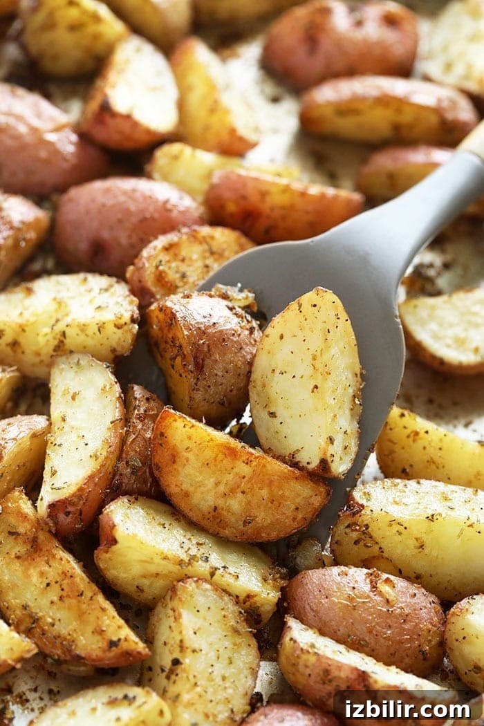 Tossing roasted red potatoes tossing red potatoes