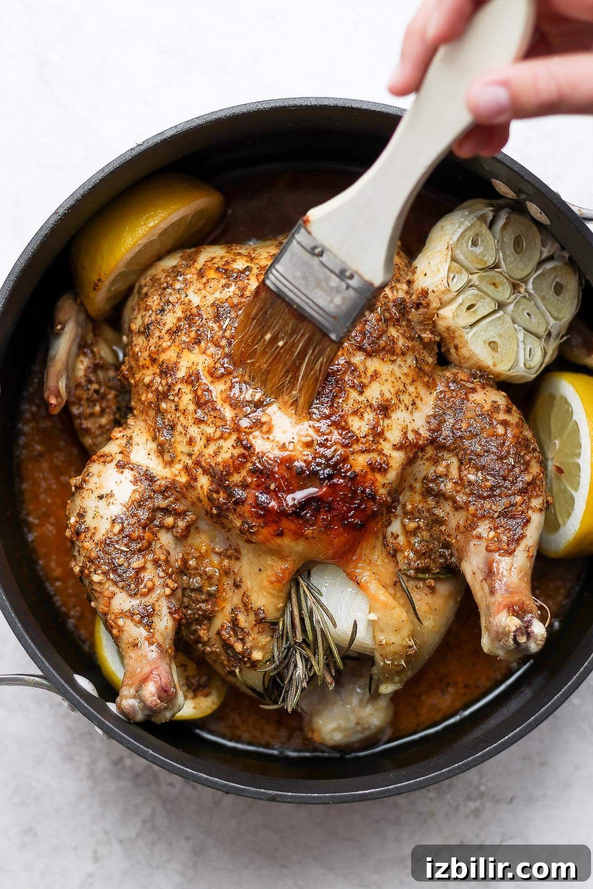 Basting the chicken while roasting keeps the meat juicy and flavorful. brush basting chicken