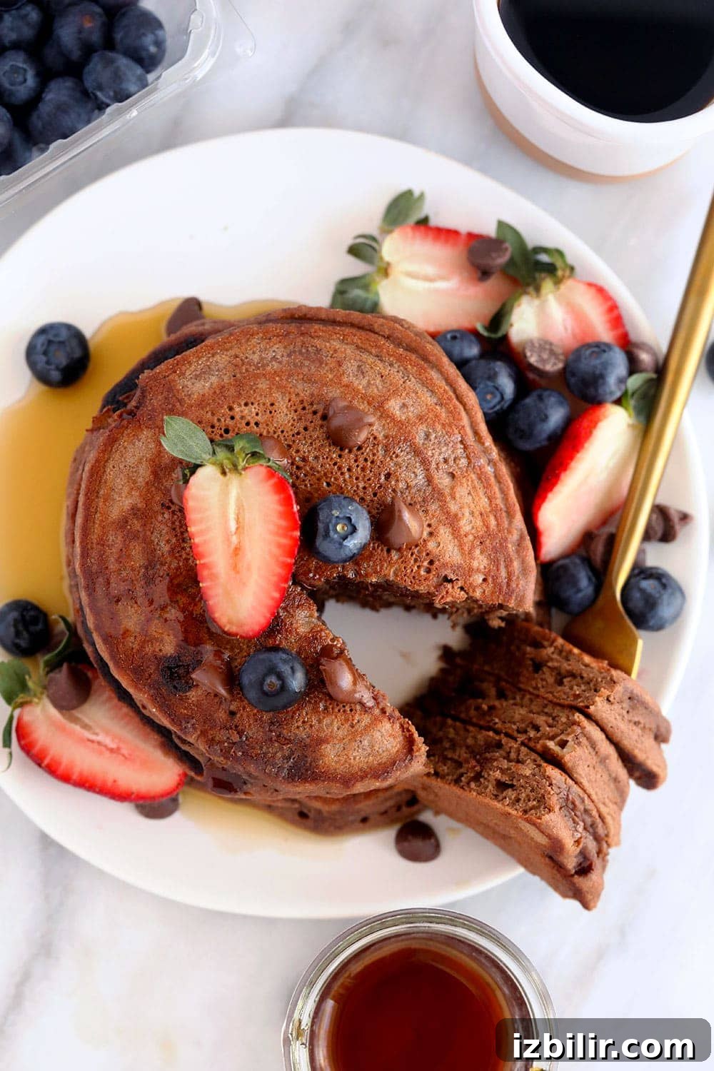 Make these Healthy Chocolate Chocolate Chip Pancakes for a delicious breakfast the whole family will love! chocolate chocolate chip pancakes on a plate