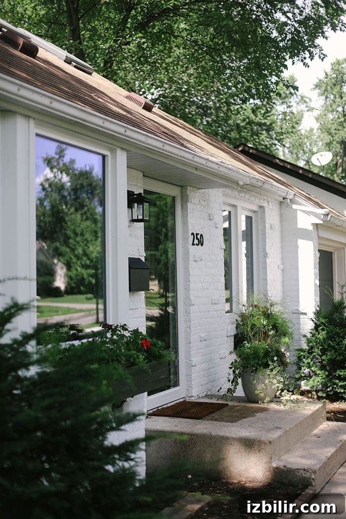 white brick house with black numbers