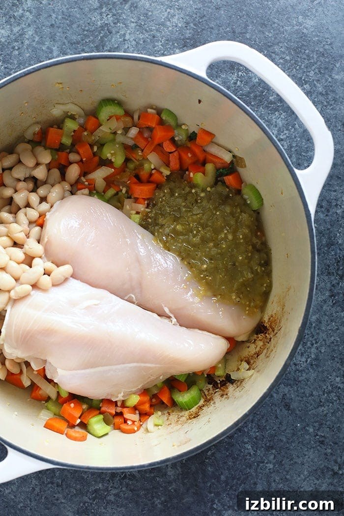 Ingredients for the spicy noodle soup in a dutch oven