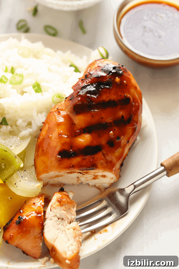 Grilled teriyaki chicken made with a simple homemade marinade Sliced teriyaki chicken breast on a plate