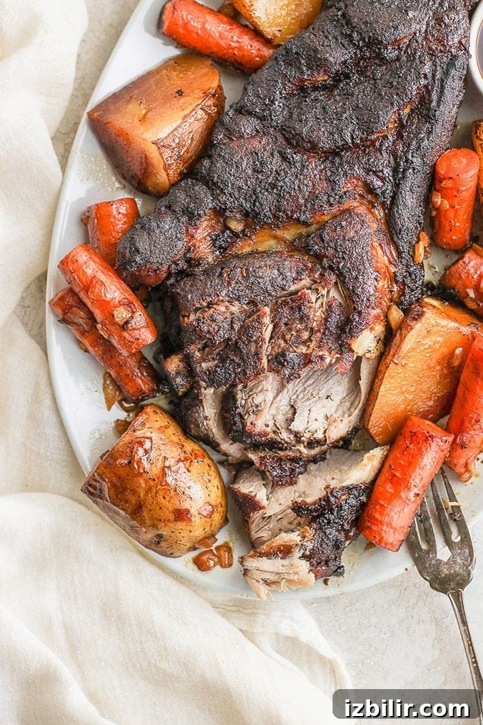 Plated pork roast with vegetables. Pork roast on a platter.