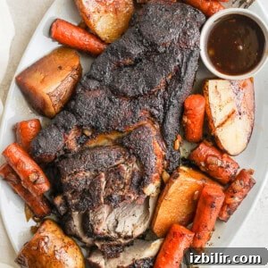 Tender Slow Cooker Pot Roast with Vegetables 3 pork roast with veggies on platter.