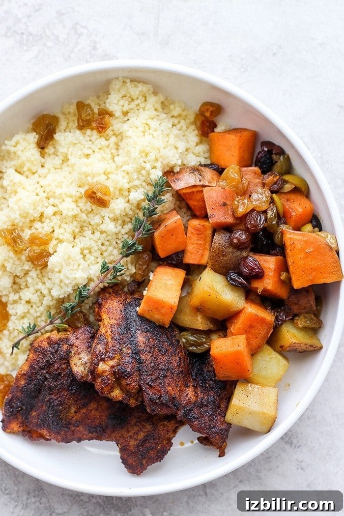 Plated moroccan chicken with couscous and vegetables