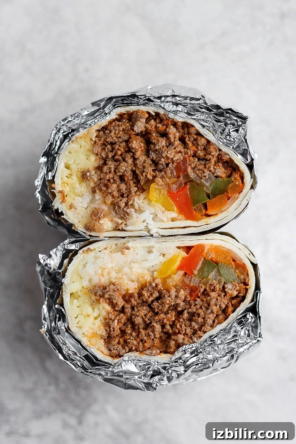 Frozen burritos wrapped in foil
