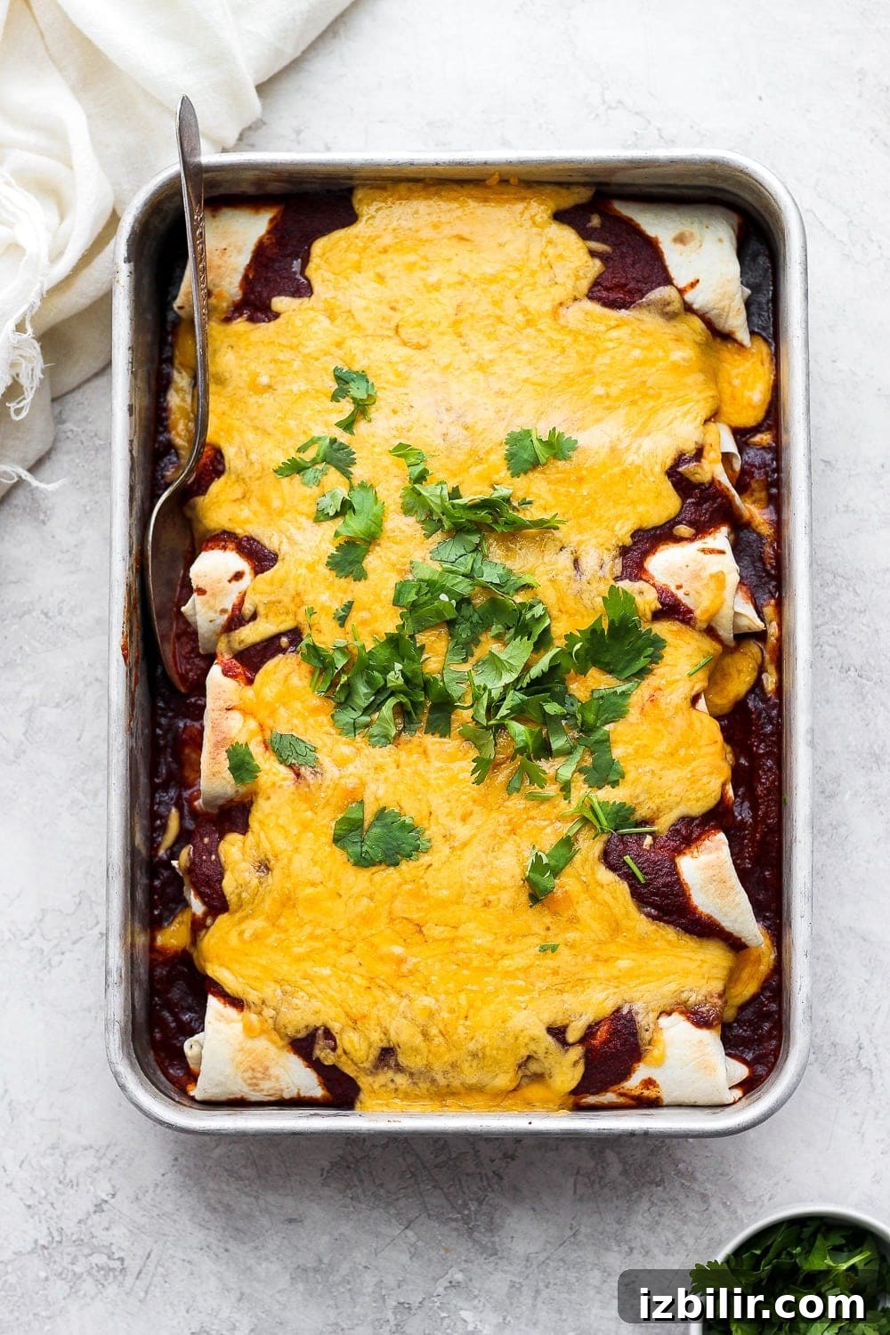 Rotisserie Chicken Enchiladas Pan of enchiladas topped with melted cheese