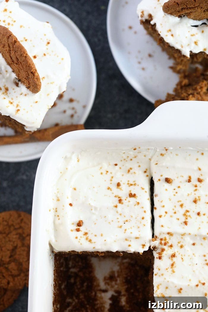 This classic Gingerbread Recipe is calling your name this holiday season! Perfectly spiced and sweet, and topped with a delicious lightened-up cream cheese frosting. Dessert is served! gingerbread topped with cream cheese frosting