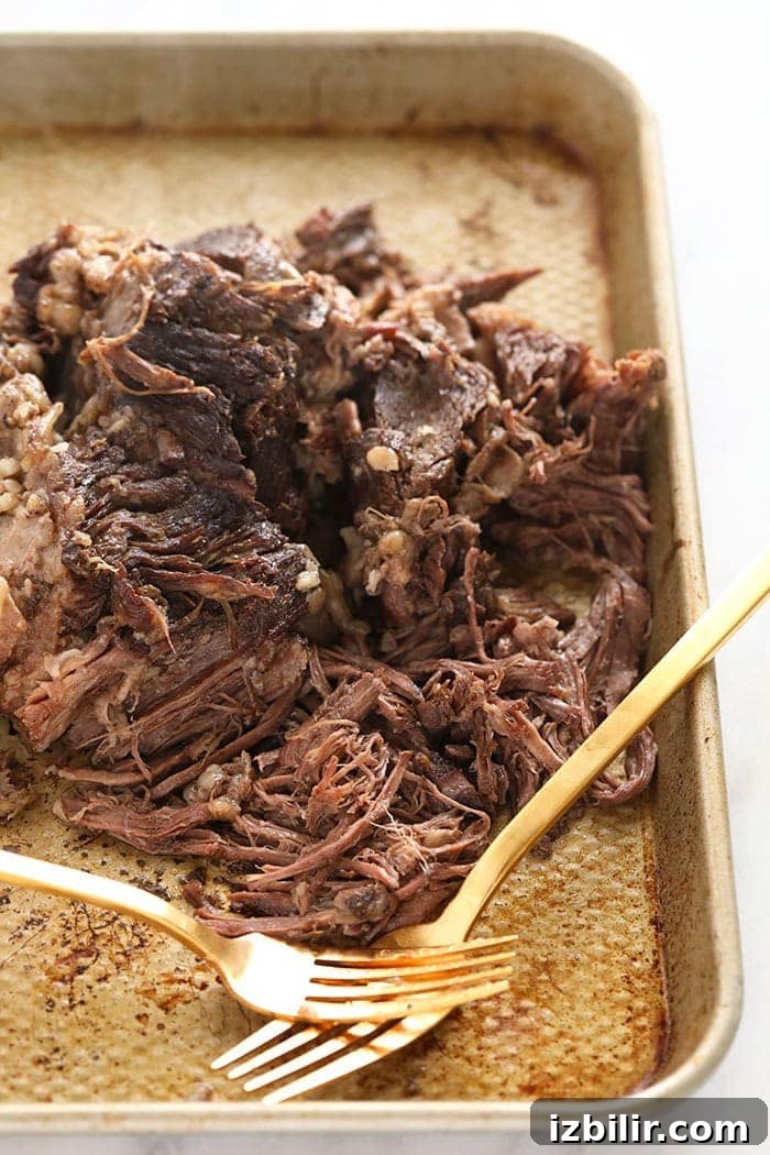 Shredded chuck roast Shredded chuck roast on a baking sheet.