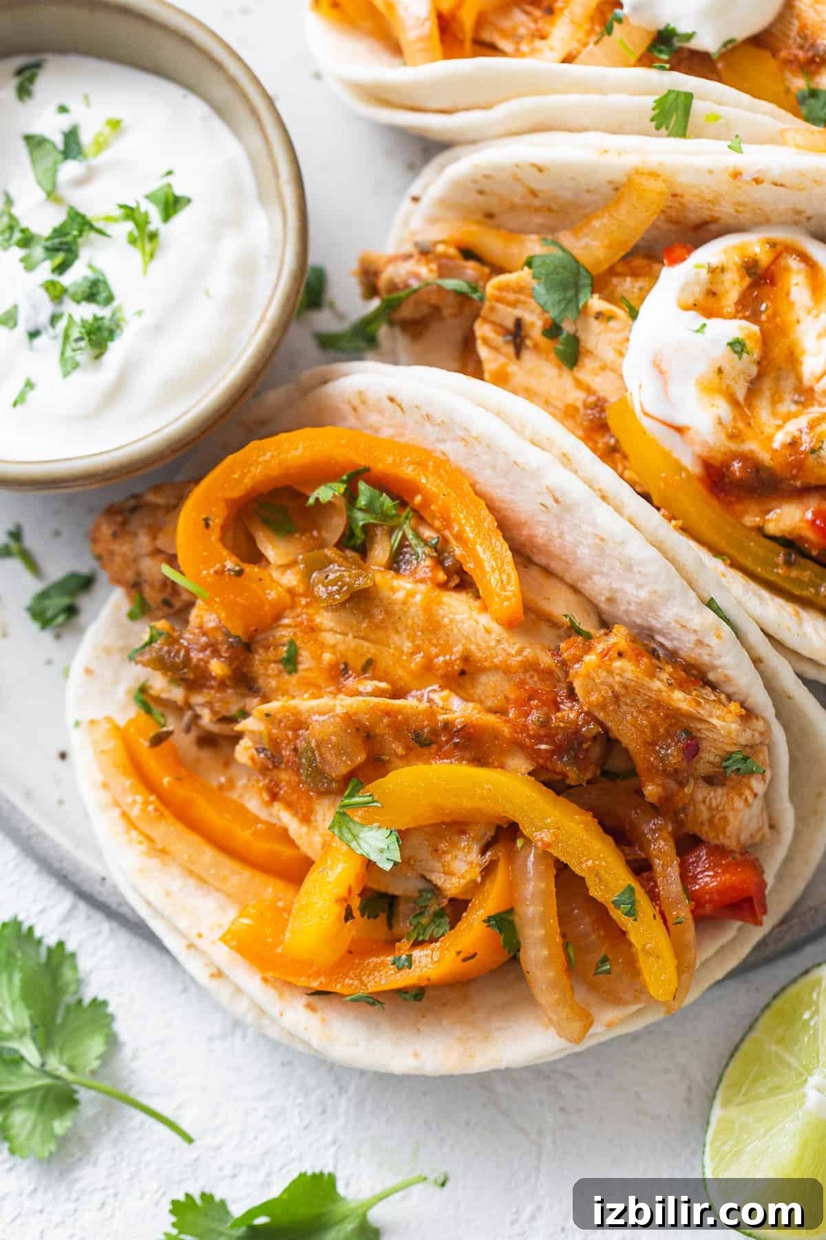 Slow Cooker Chicken Fajitas with Bell Peppers 8 Chicken tacos with peppers and sour cream.