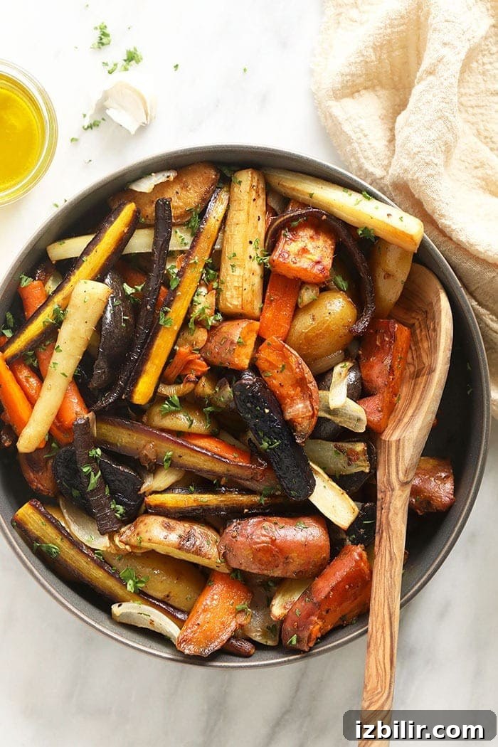 Roasted root veggies in bowl with spoon