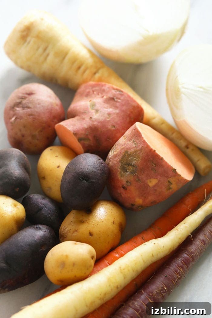 Raw root vegetables on a cutting board. 