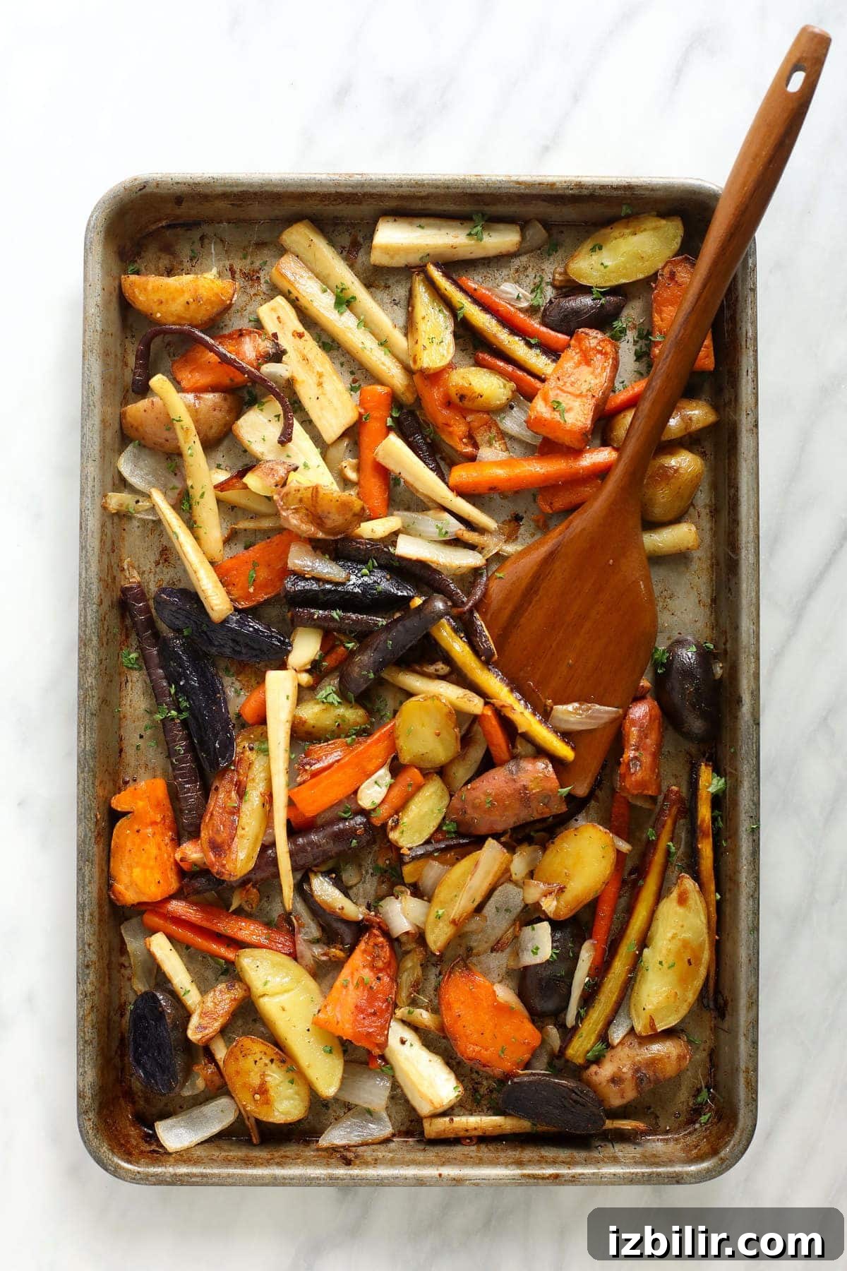 Roasted root vegetables on a baking sheet