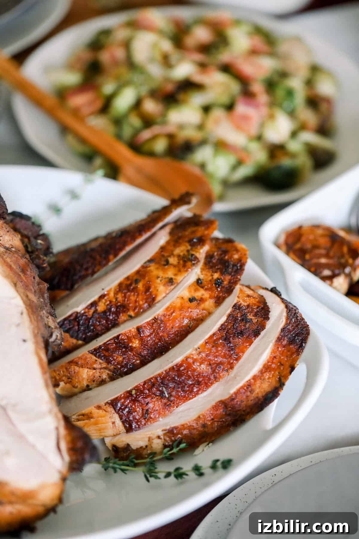 A plate with a Sous Vide turkey and vegetables on it.