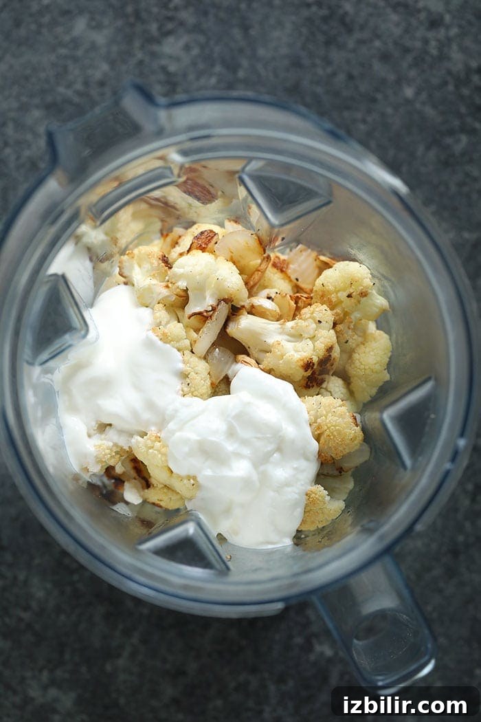 All the ingredients for cauliflower mash in a blender