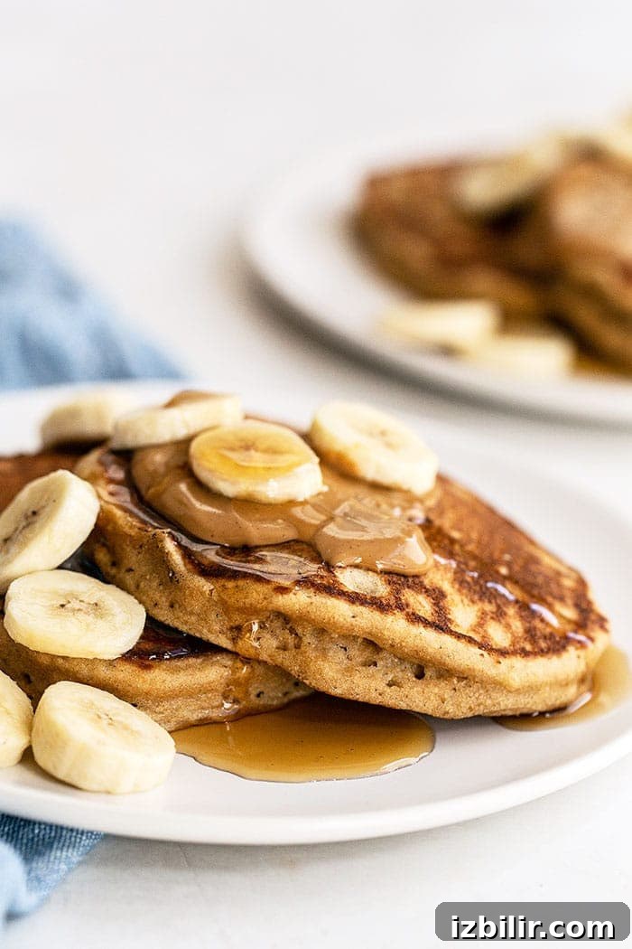 Peanut butter banana pancakes plated A plate of peanut butter banana pancakes