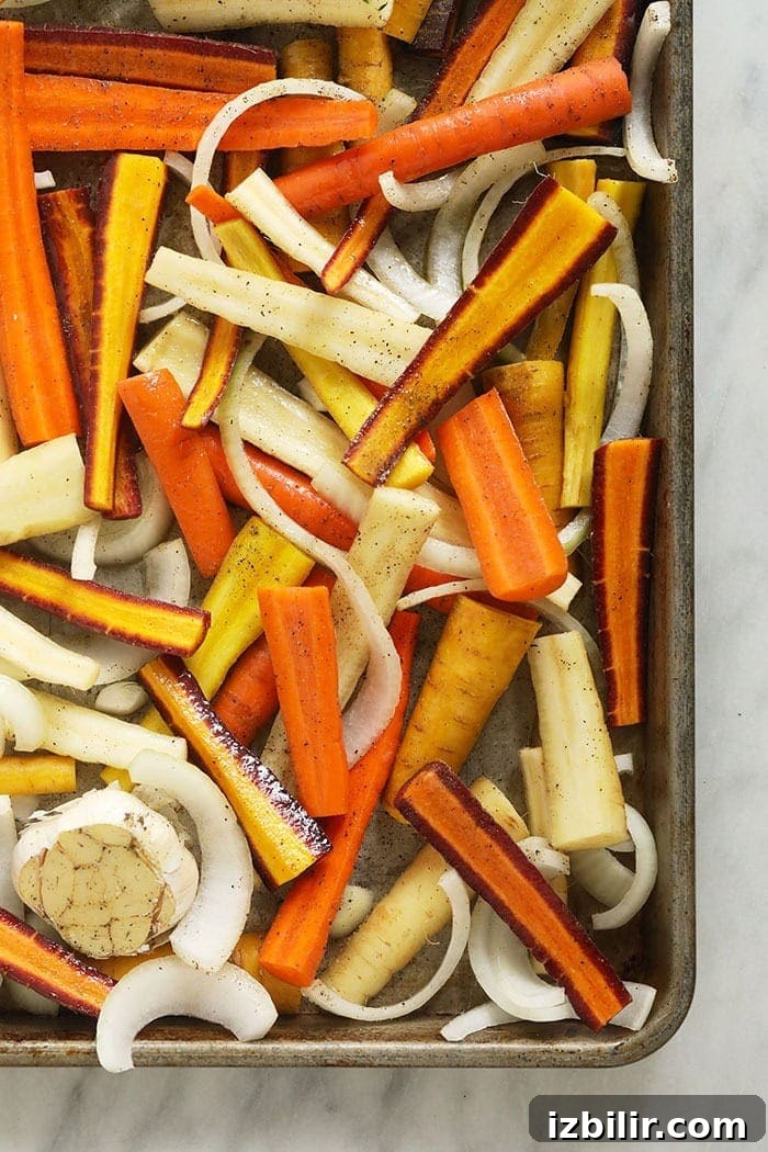Carrots and onions on a baking tray fresh cut carrots and onions on a baking tray