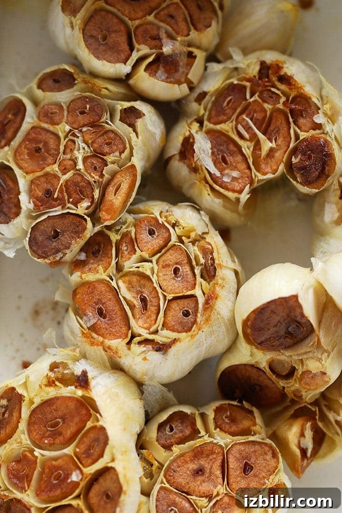 Making your own roasted garlic could not be easier! roasted garlic cloves in a baking dish