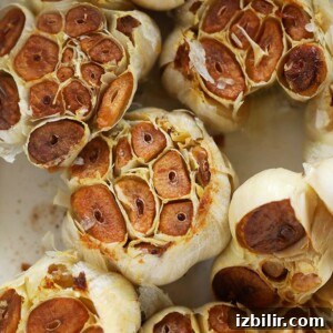 How to Roast Garlic for Sweet, Spreadable Cloves 3 roasted garlic cloves close up