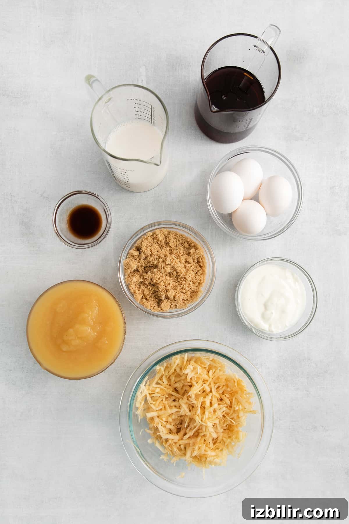 Ingredients for apple cake in small bowls.