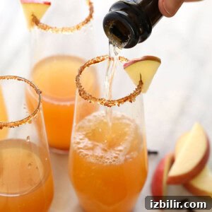 Apple cider being poured into a glass.