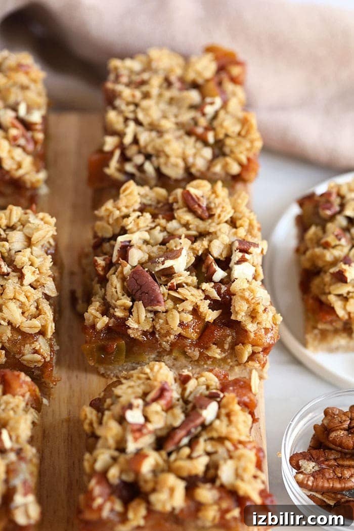 Apple crumble bars ready to eat apple crumble bars on cutting board
