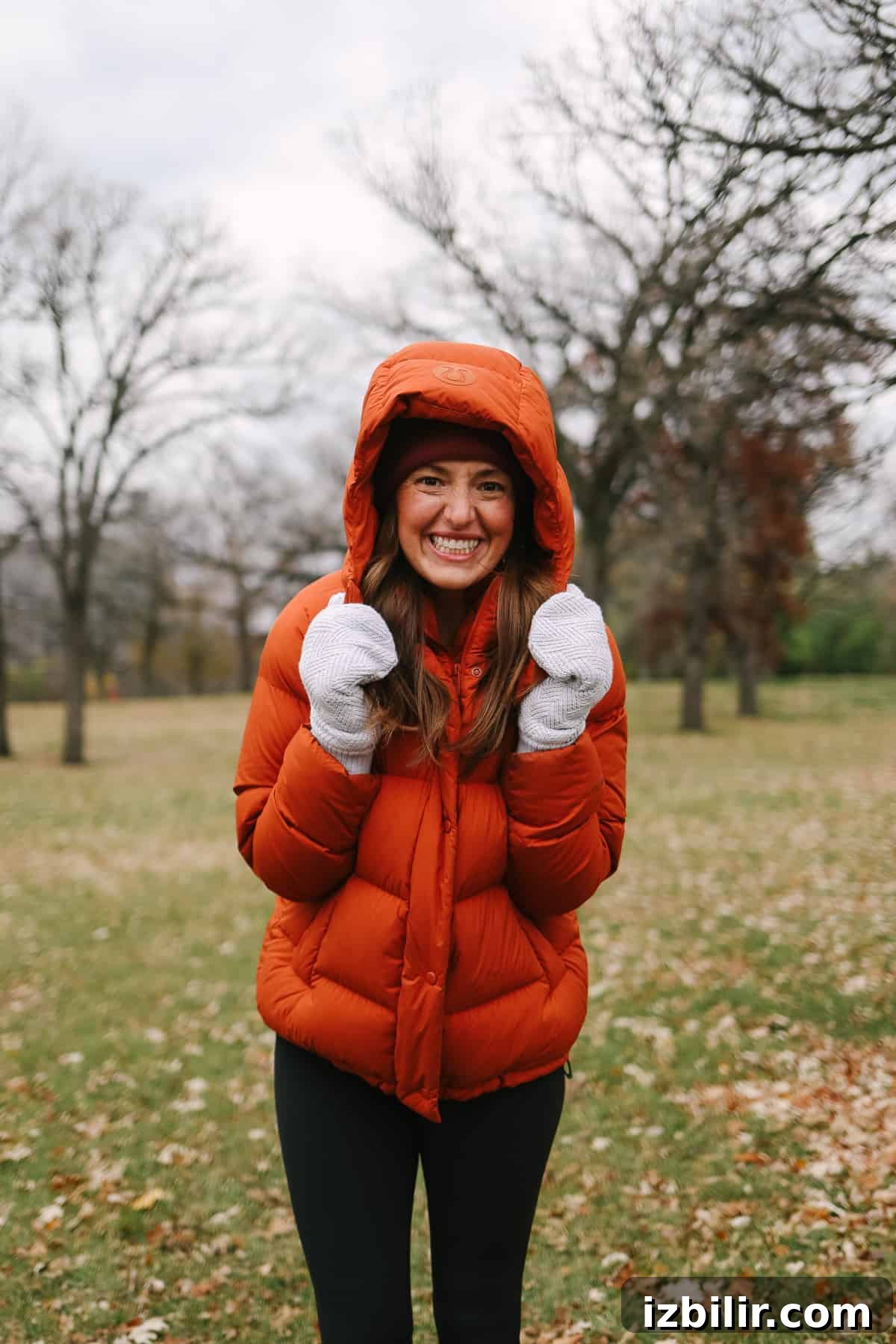 Woman smiling in a puffy jacket