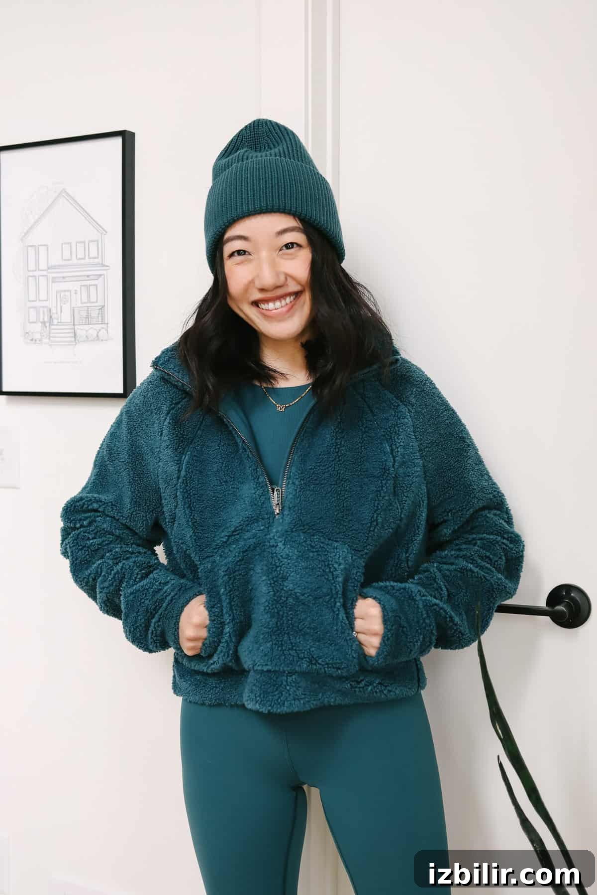 Woman wearing a cozy sherpa zip-up