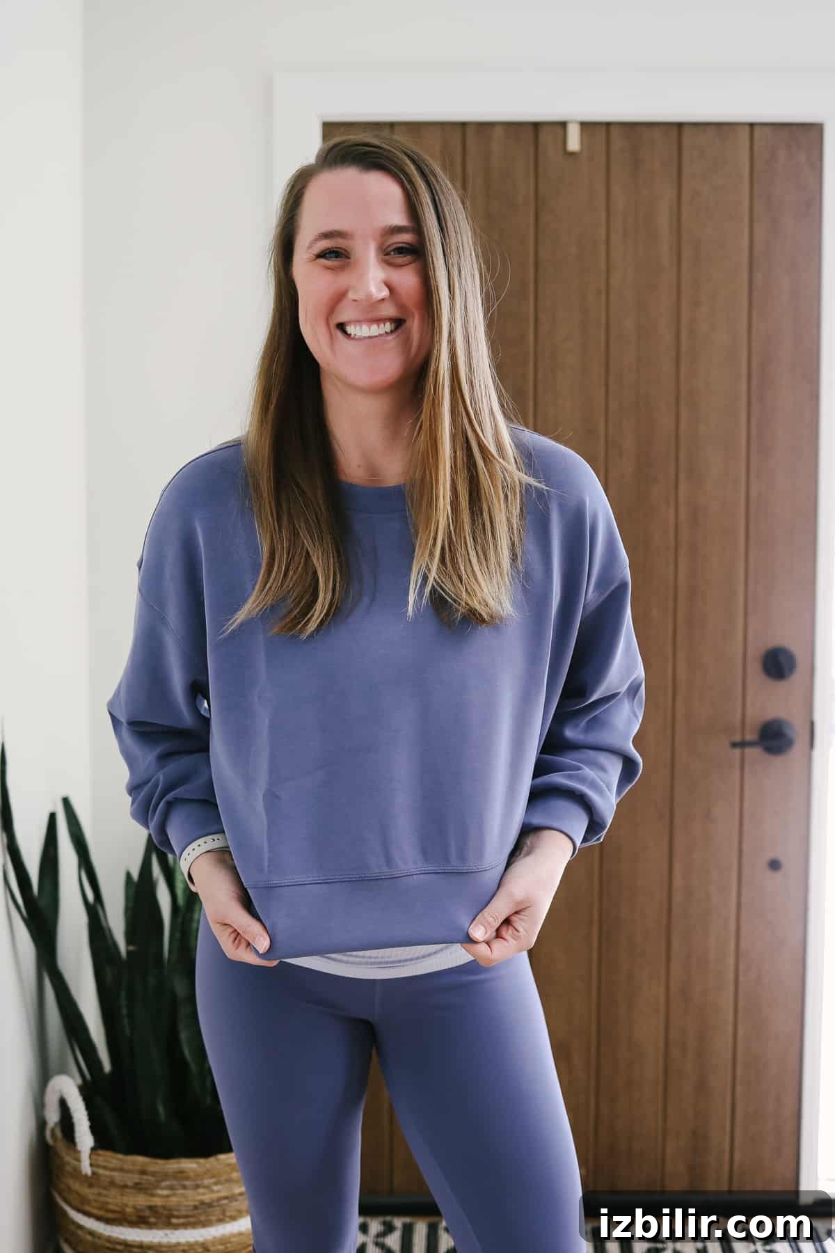 Woman wearing a periwinkle sweatshirt