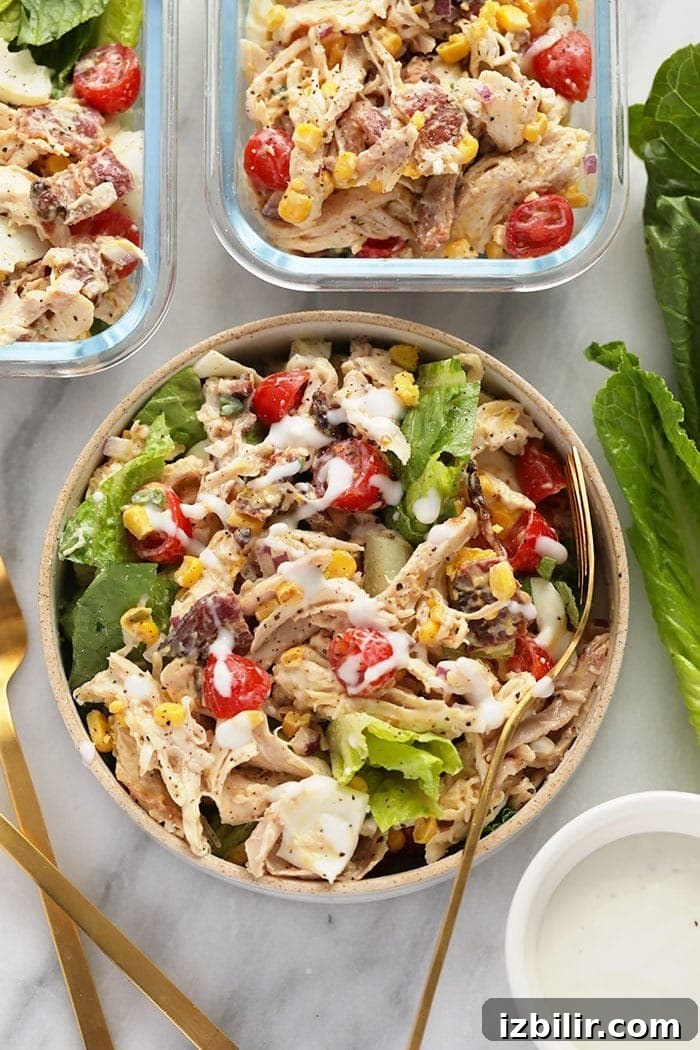 Your lunch for the week is ready in less than 30 minutes with this protein-packed Rotisserie Chicken Cobb Salad! rotisserie chicken cobb salad in a bowl ready to be eaten