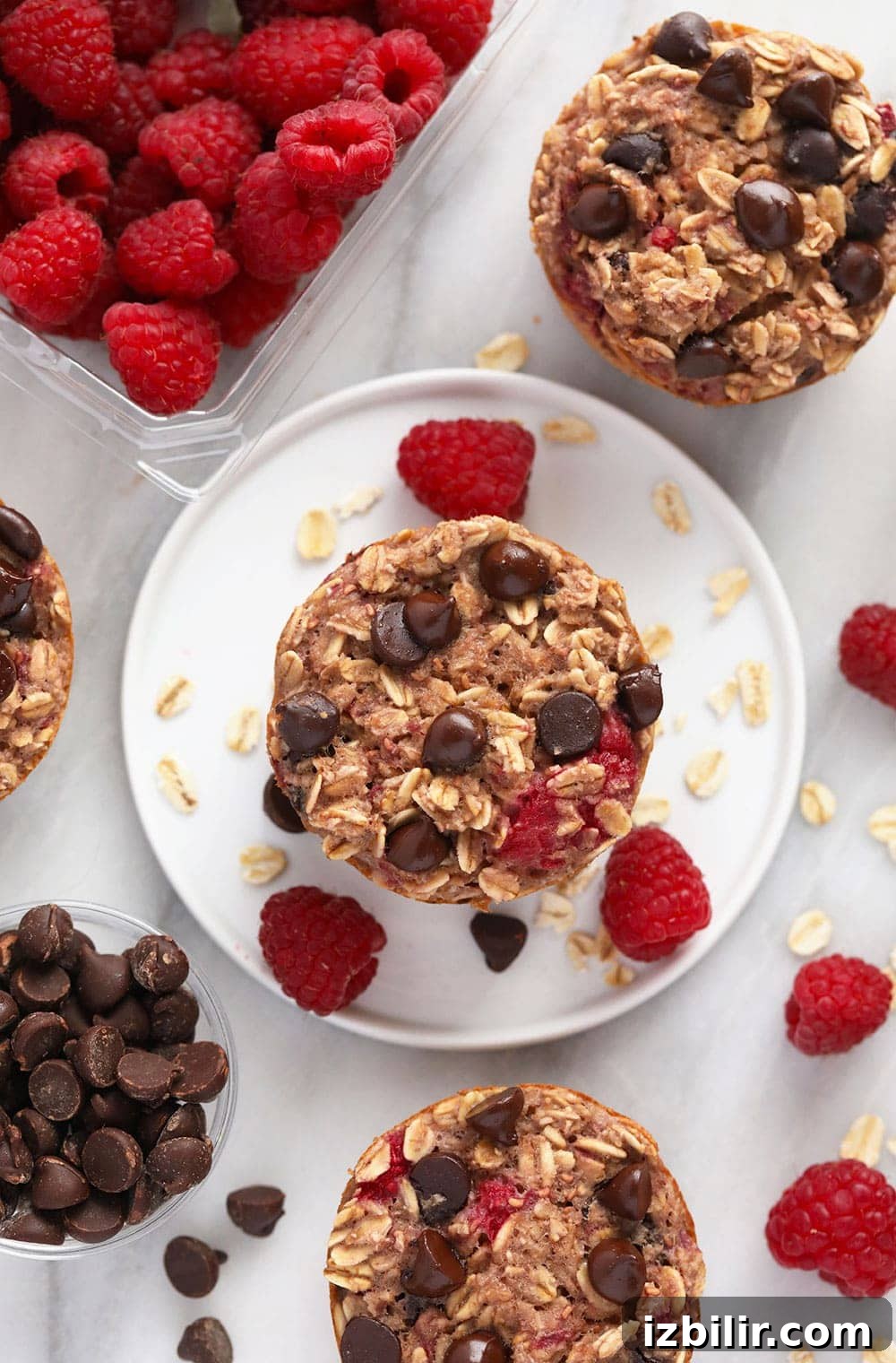 Raspberry Chocolate Chip Baked Oatmeal Cups baked oatmeal cups on plate