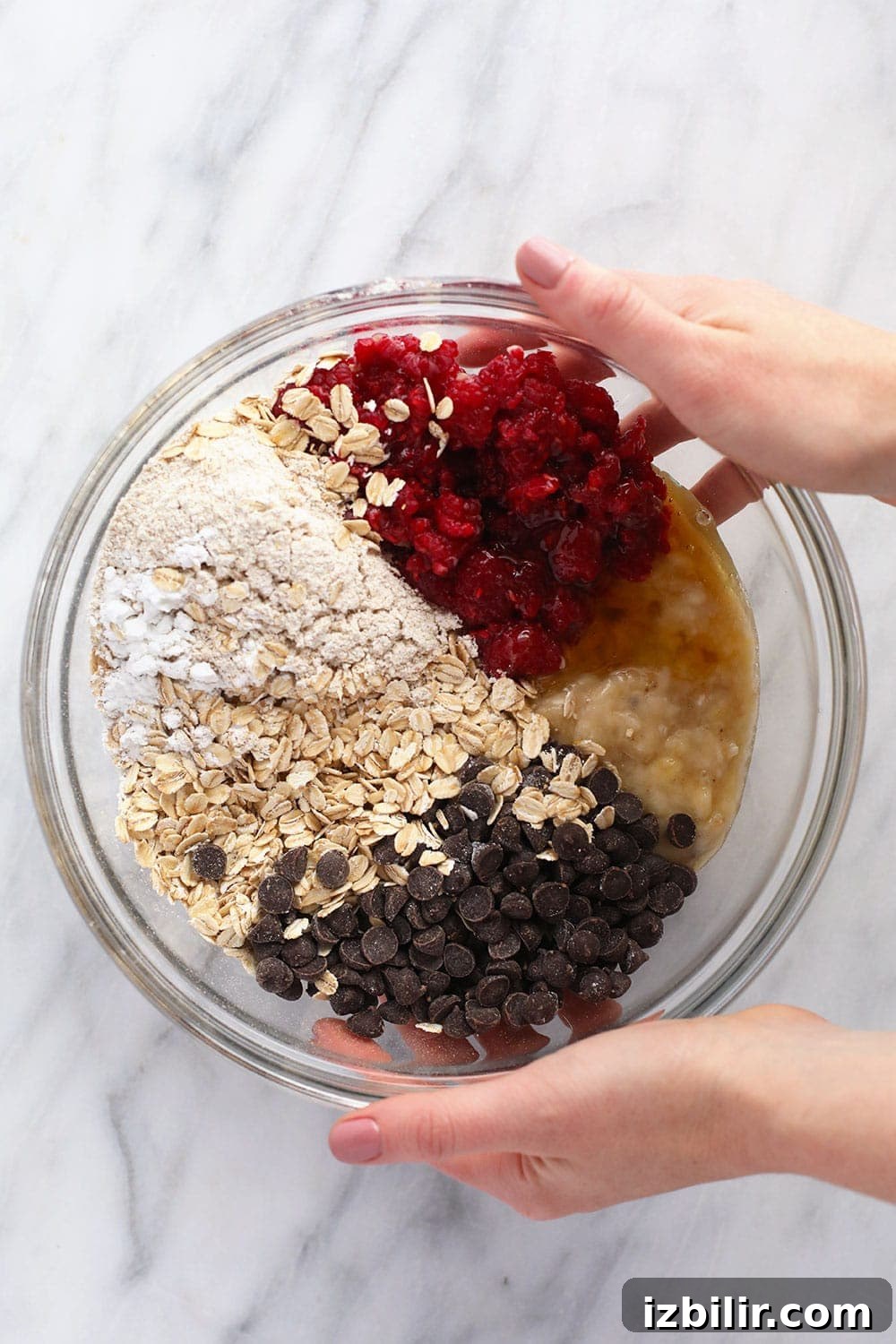 Ingredients for Raspberry Chocolate Chip Baked Oatmeal Cups Raspberry baked oatmeal cups ingredients in bowl