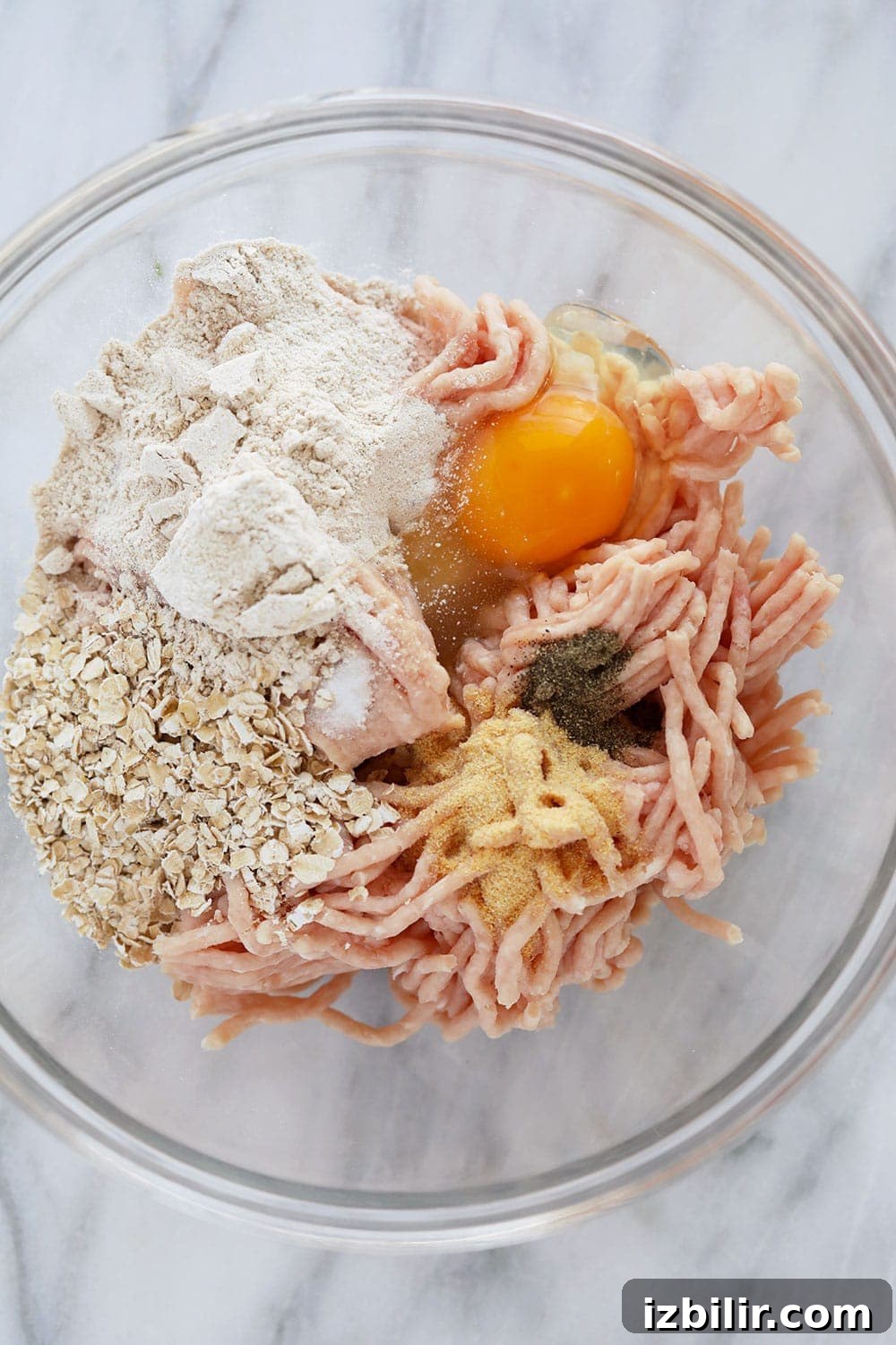 Ingredients for tikka meatballs in a bowl