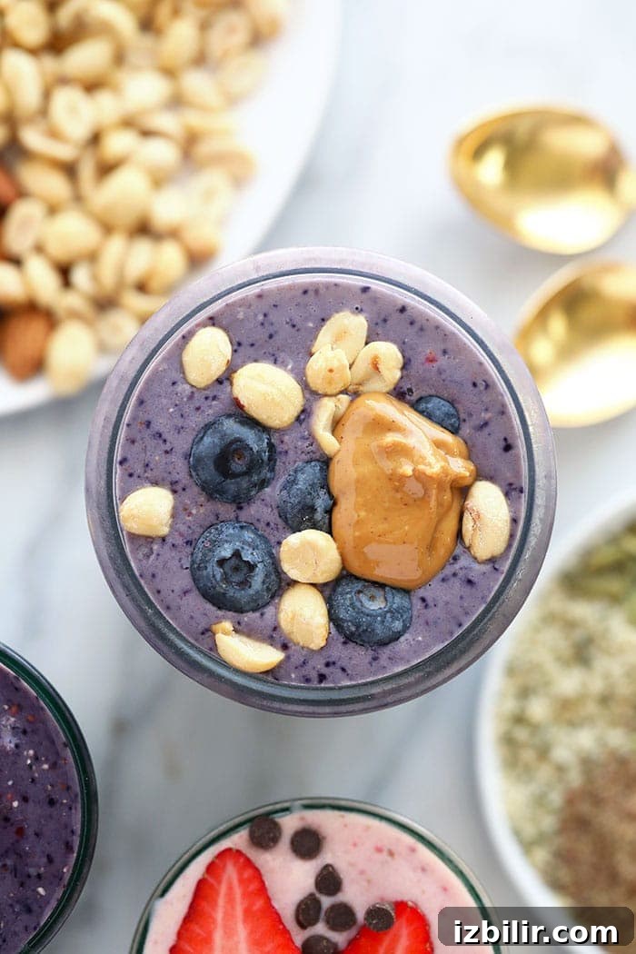This peanut butter and jelly protein smoothie is a tasty and healthy twist on your favorite childhood classic. Plus it is the perfect post-workout snack packed with protein and deliciousness. PB&J protein shake.