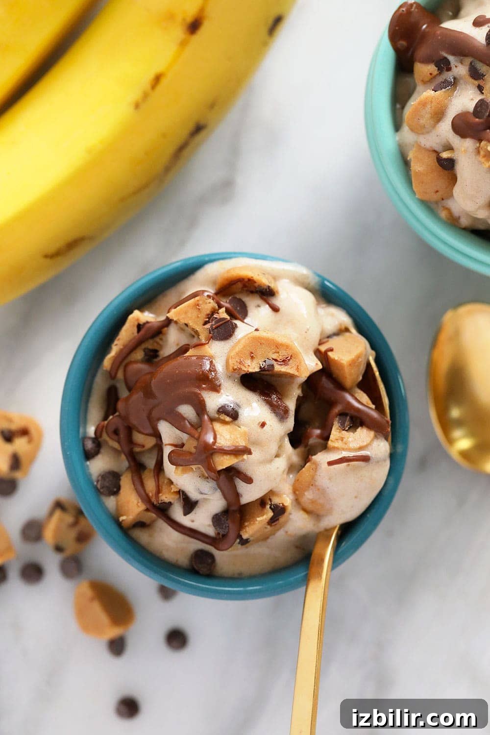 A bowl of cookie dough banana nice cream.
