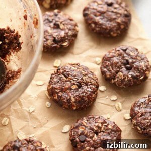 No bake chocolate oatmeal cookies arranged on a baking sheet.