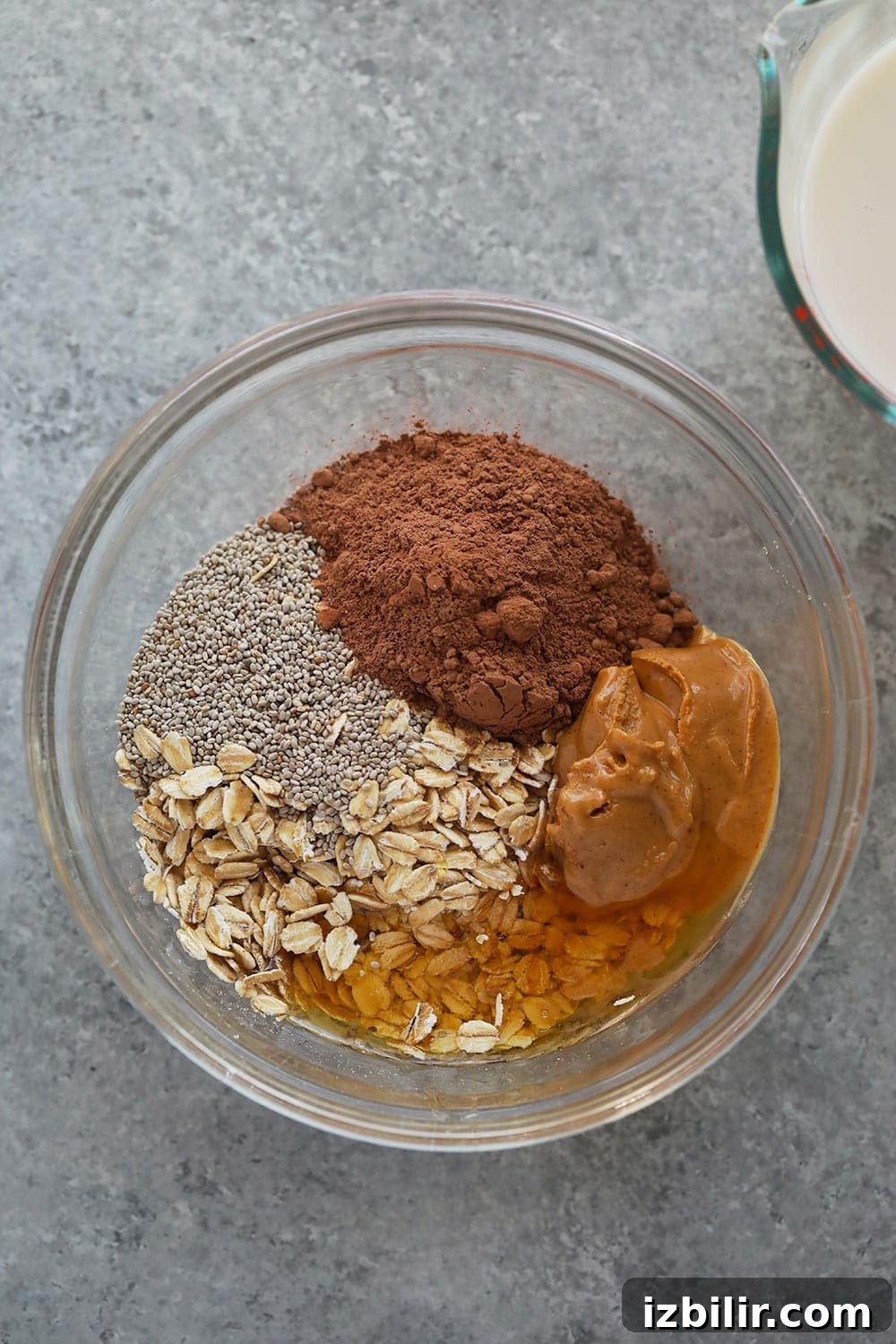 Chocolate peanut butter overnight oats ingredients in a bowl.