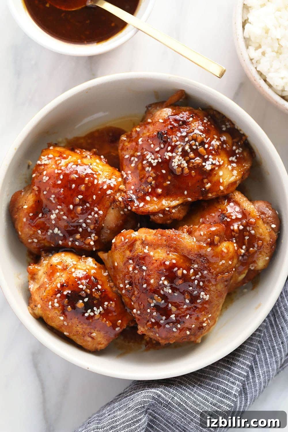 Honey Garlic Chicken Thighs honey garlic chicken thighs in bowl.