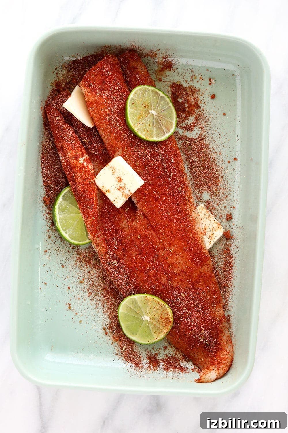 This baked fish taco recipe is flavorful, easy to make, and perfect for a 30-minute meal all year round! Cod fillet in a baking dish
