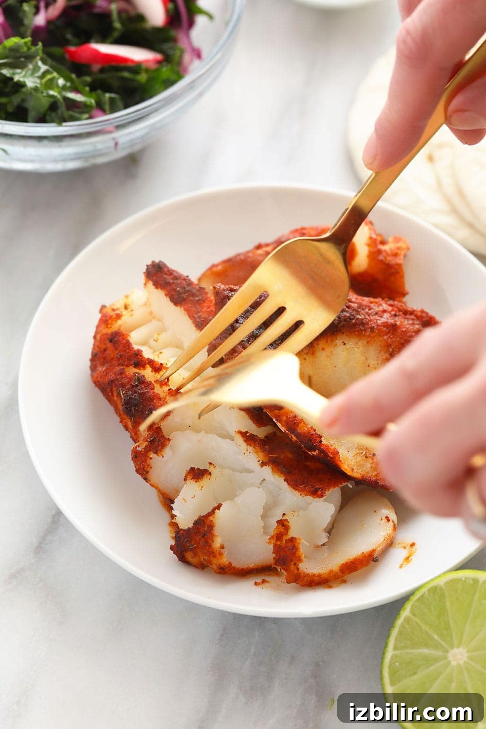 This baked fish taco recipe is flavorful, easy to make, and perfect for a 30-minute meal all year round! Chunking fish for fish tacos