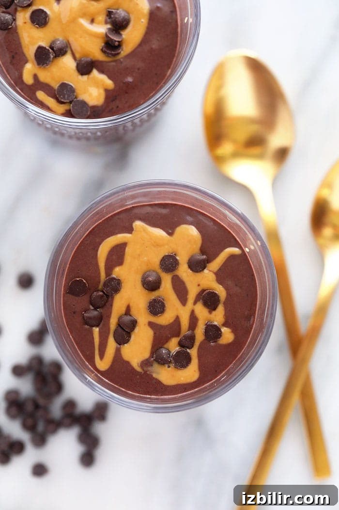 Protein shake topped with almond butter and chocolate chips