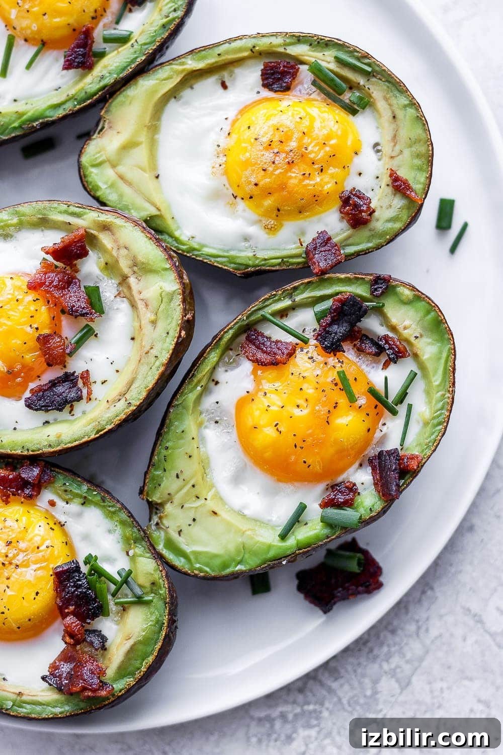 These avocado baked eggs are an easy low carb breakfast that you can meal prep for the whole week! Avocado egg bake on a plate
