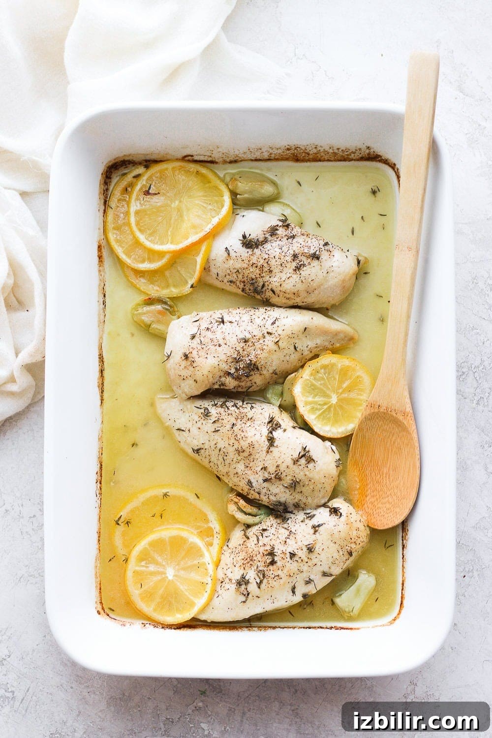 Baked lemon chicken in a casserole dish.
