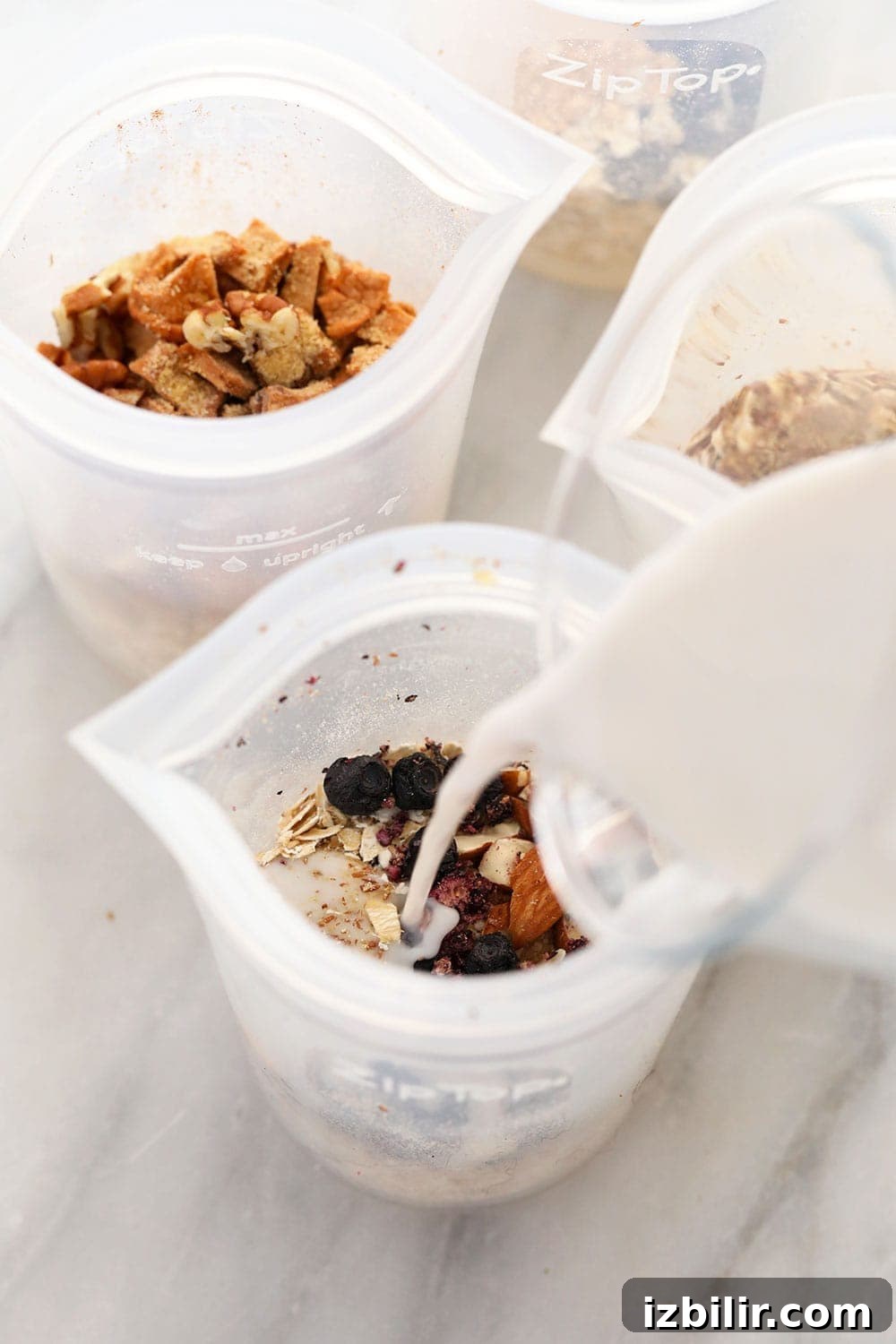 instant oatmeal 4 ways mixed in bowls with milk being poured over them