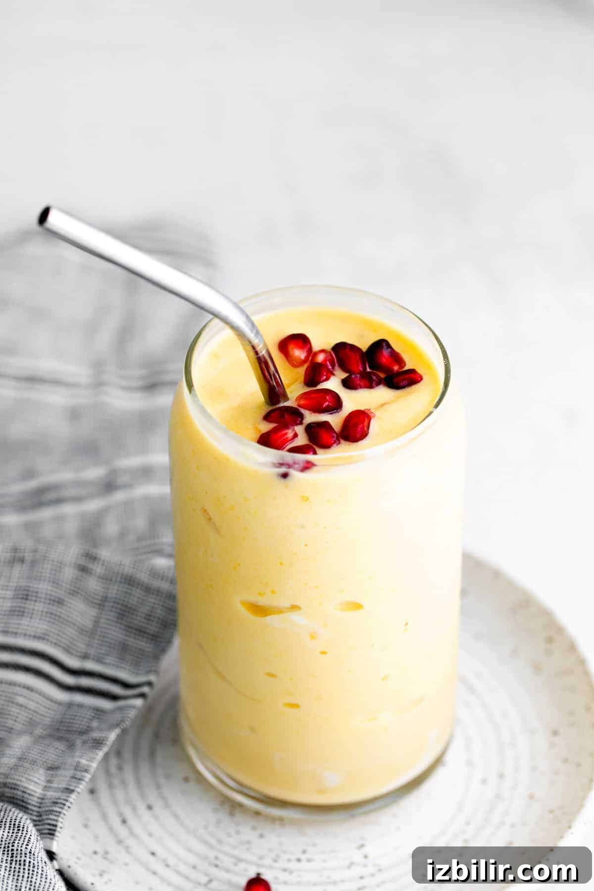 Creamy Mango Smoothie Recipe 2 Mango smoothie in a glass.