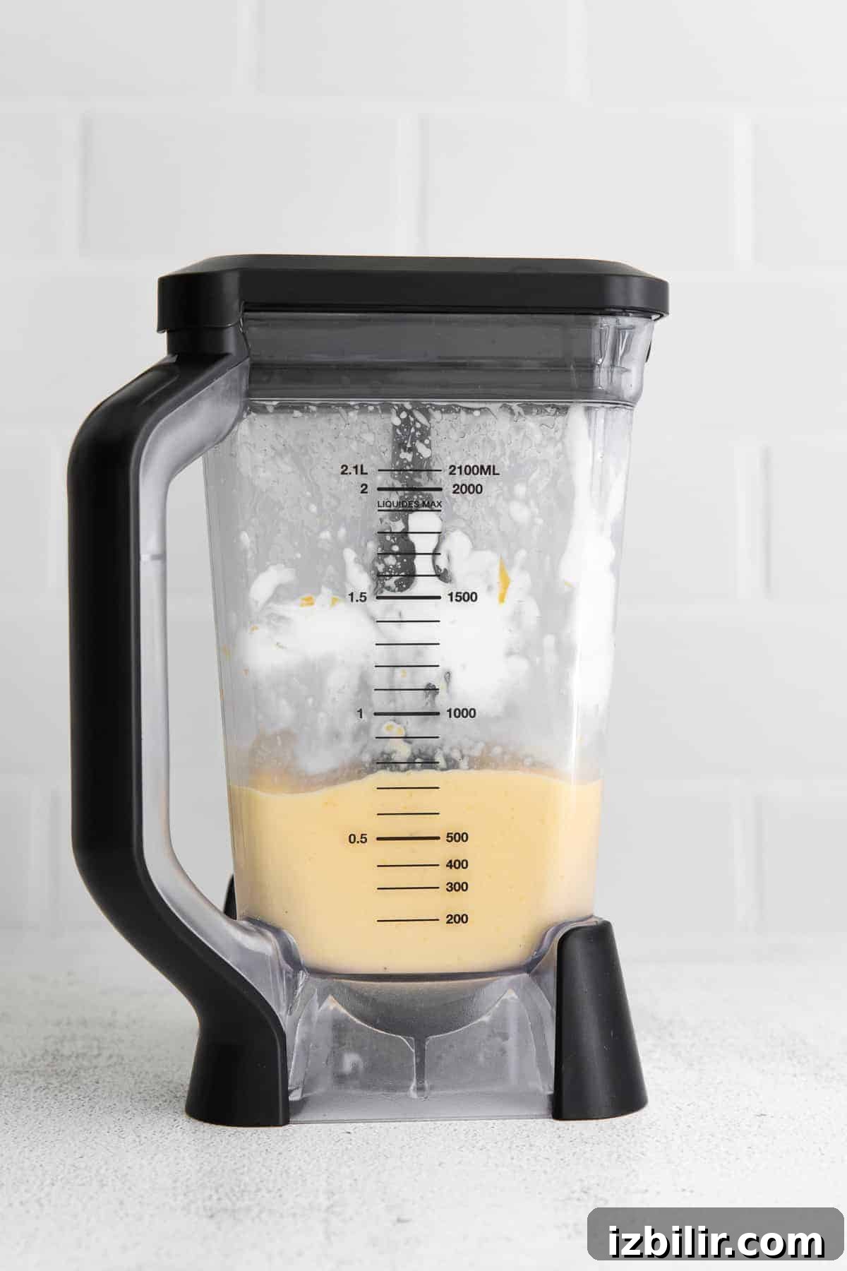 Creamy Mango Smoothie Recipe 5 Creamy mango smoothie in a blender.