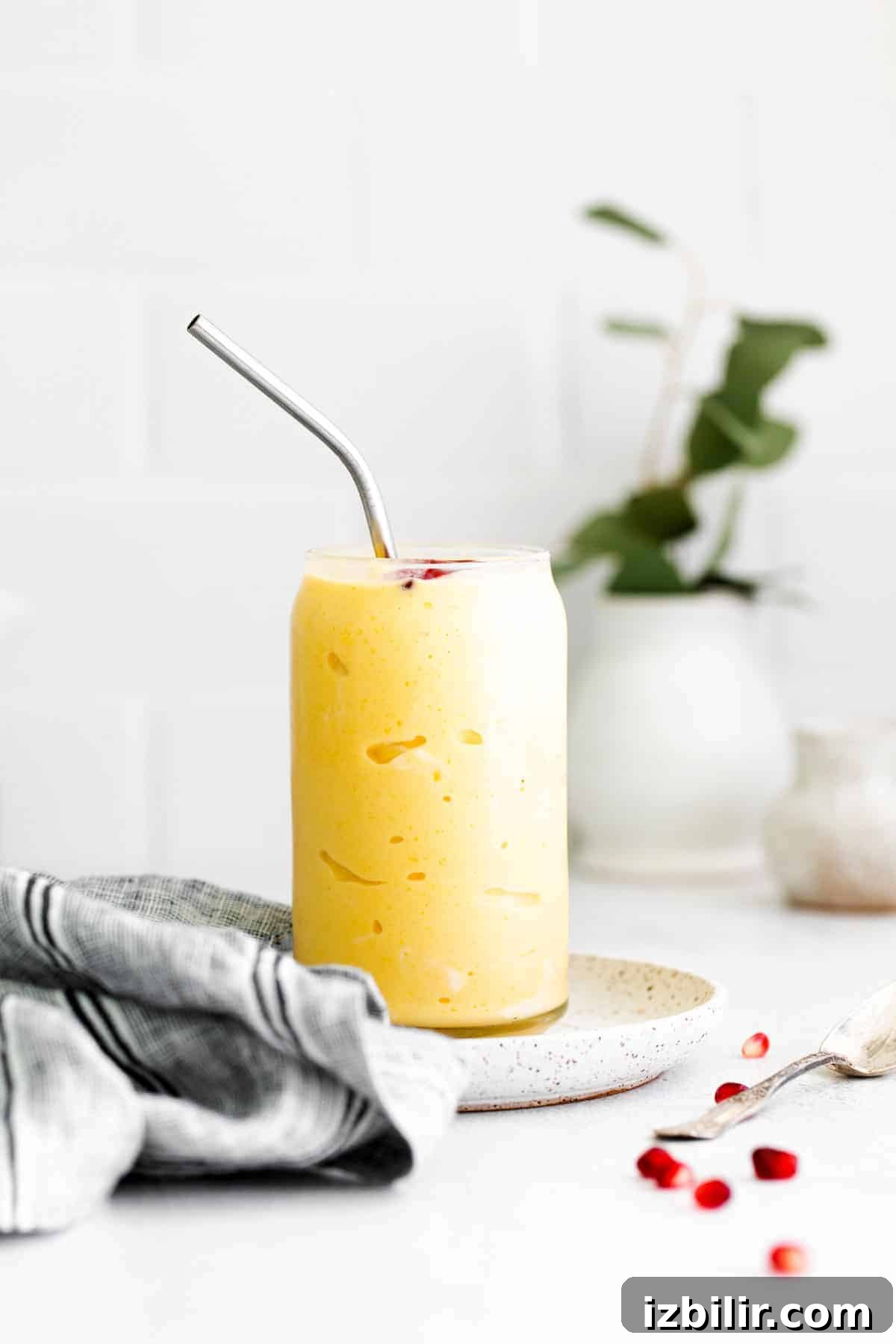 Creamy Mango Smoothie Recipe 6 Mango smoothie in a glass.