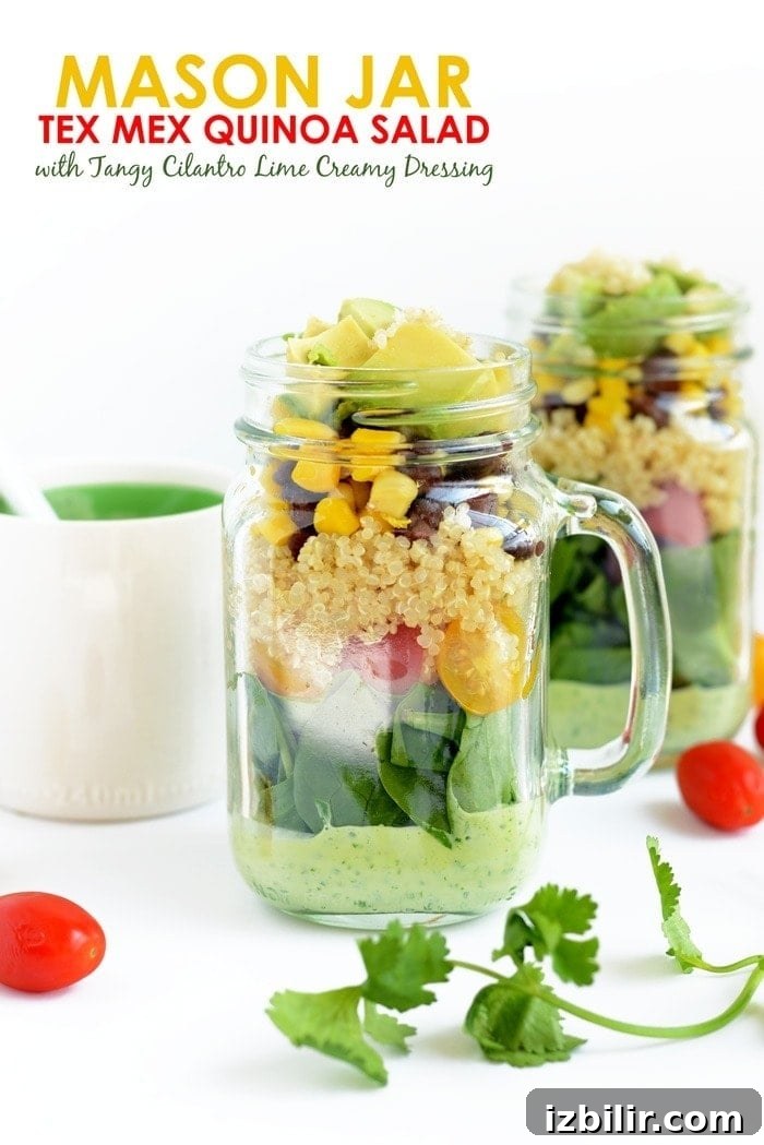 A mason jar salad with dressing on the bottom and ingredients on the top.